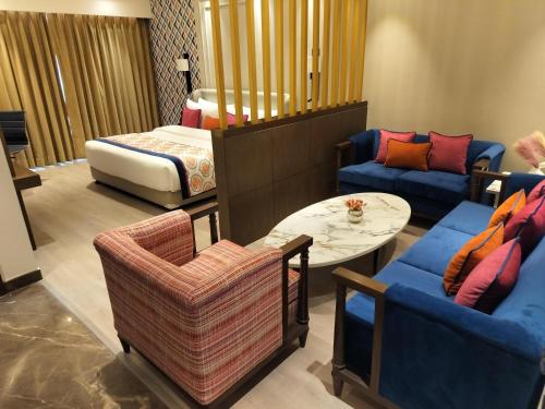 a living room with a couch and a table at Fortune Park, Aligarh - Member ITC Hotels' Group in Alīgarh