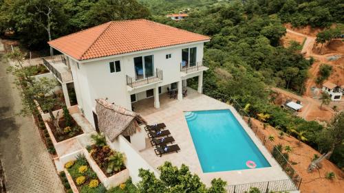 an aerial view of a house with a swimming pool at Seaside Serenity at Casa Cala Azul home in San Juan del Sur