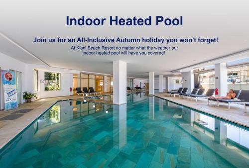 an indoor heated pool at an all inclusive atrium holiday house you wont forget at Kiani Beach Resort Family All Inclusive in Kalyves