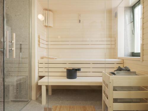 a bathroom with a sink and a shower at OSTKÜSTE - Villa Steigel Design Apartments in Ahlbeck