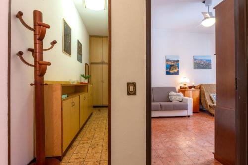 a hallway with a kitchen and a living room at Maison d' Ofelia in Chiavari