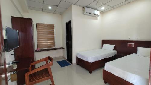 Fotografija u galeriji objekta Masterkey Deluxe Rooms u gradu Kakanad