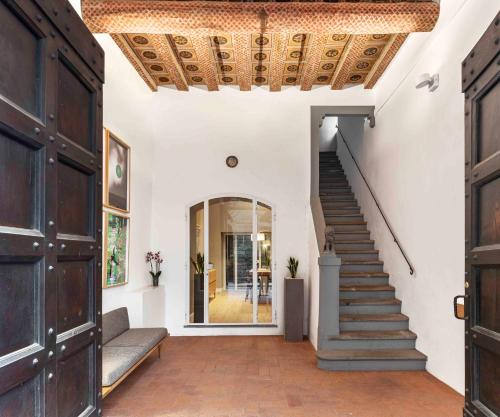 a hallway of a house with a wooden ceiling at BSJ15-Borgo San Jacopo Room in Florence