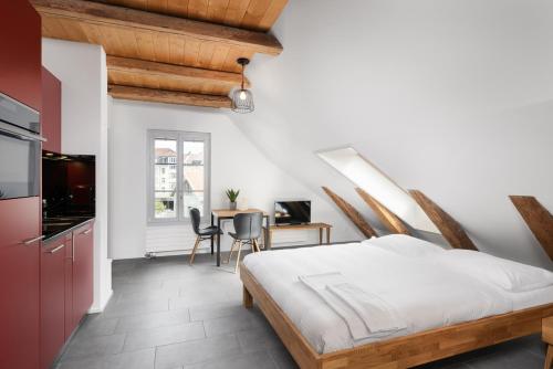 En eller flere senge i et værelse på Studio SARA Interlaken