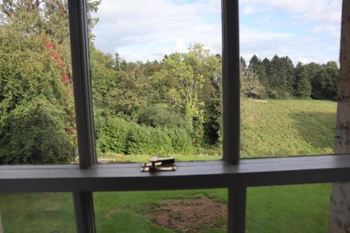 a window with a view of a field at Holbrook Manor & Spa in Wincanton