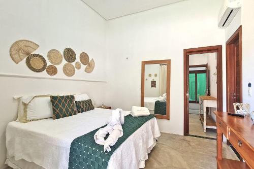 Giường trong phòng chung tại Chalés em Jericoacoara por Carpediem