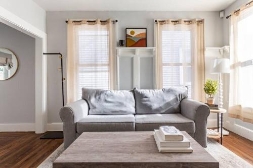 a living room with a couch and a table at The Santiago Yale New Haven with Parking and Modern in New Haven