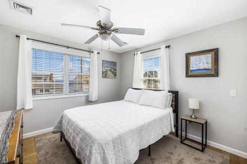 a bedroom with a bed and a ceiling fan at Beautiful Home With Water Views & Close To Ocean in Warwick