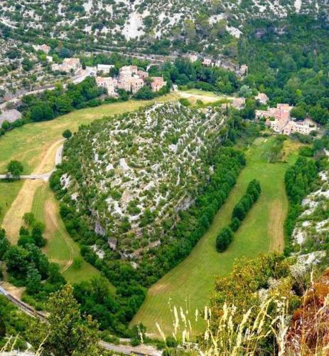 an aerial view of a park with houses and trees at Appartement de Charme dans un Ancien Mas Cévenol piscine et jacuzzi in Valleraugue
