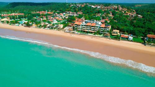 an aerial view of a beach with houses and the ocean at Waterfront Apart Hotel in Maceió