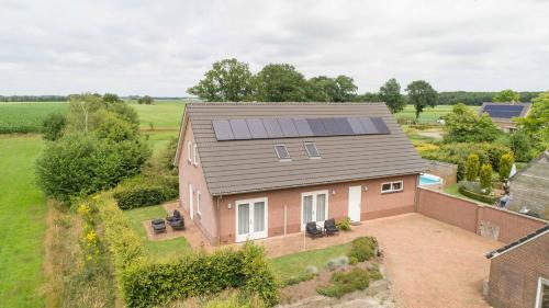 an overhead view of a house with solar panels on it at Bed & Breakfast Inn Drenthe in Fluitenberg