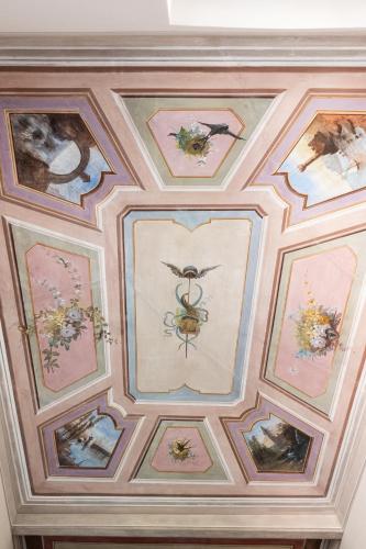 a ceiling with paintings of a bee on it at Villa Smeralda - Luxury on the Italian Riviera in Lavagna