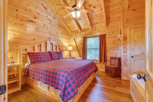 a bedroom with a bed in a log cabin at Journey's End in Gatlinburg