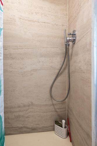a shower in a bathroom with a hose at Villa Smeralda - Luxury on the Italian Riviera in Lavagna