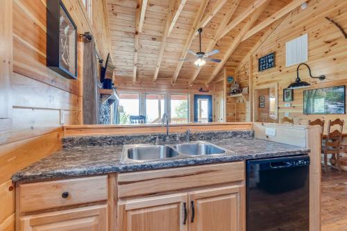 a kitchen with a sink and a stove at Life's A Bear in Gatlinburg