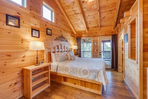 a bedroom with a bed in a log cabin at Always in Gatlinburg