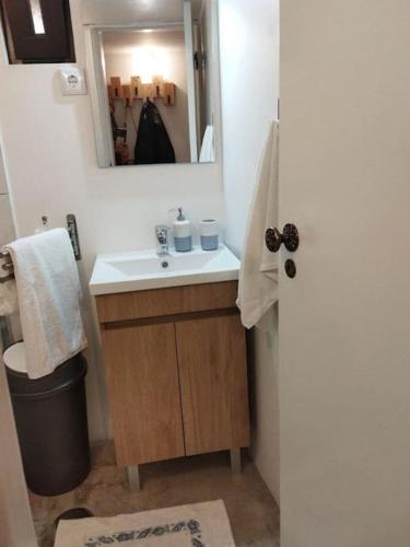 a bathroom with a sink and a mirror at Casa das Moitinhas in São Pedro do Sul