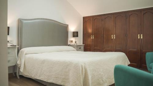 Postel nebo postele na pokoji v ubytování Hotel Restaurante Boabdil