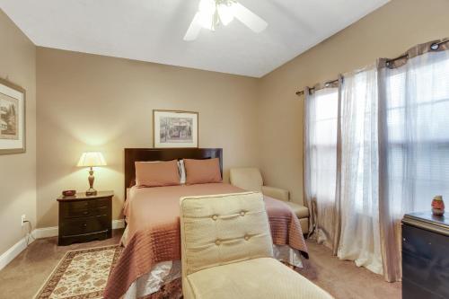 a bedroom with a bed and a window at Atlanta Retreat with 2-Car Garage, Fenced Yard home in Locust Grove