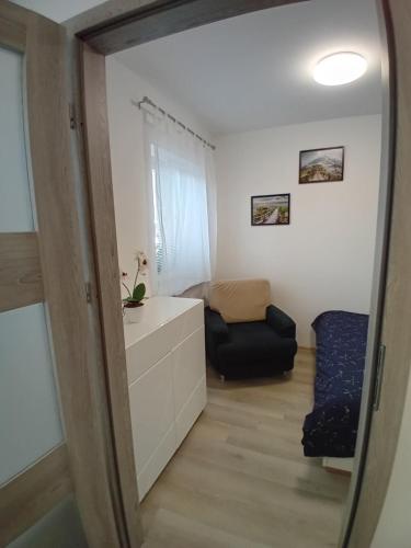 a mirror view of a small room with a bedroom at Nový byt Liberec 30 in Liberec