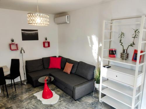 a living room with a couch and a table at RYB Lofts Budapest in Budapest