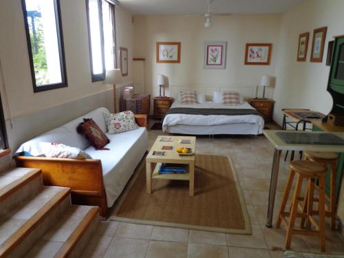 Postel nebo postele na pokoji v ubytování Casa Flora Garden Studio (Gite)