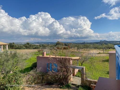 a view of a field from a house at Tapia Hills in Methoni