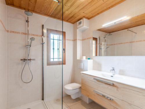 a bathroom with a shower and a toilet and a sink at Appartement Morzine, 5 pièces, 10 personnes - FR-1-754-19 in Morzine