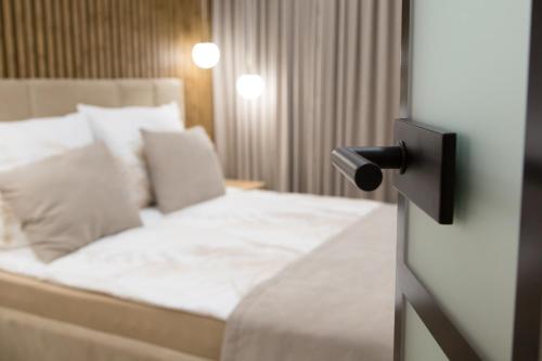 Postel nebo postele na pokoji v ubytování Apartament POSEJDON Gliwice