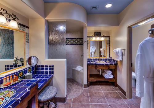 a bathroom with a sink and a toilet and a shower at Hacienda del Sol Guest Ranch Resort in Tucson