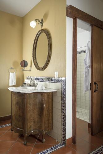 a bathroom with a sink and a mirror at Hotel Tapalpa de Mis Amores in Tapalpa