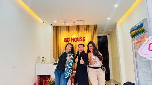 a group of three women standing in a room at Bơ House hotel in Da Lat