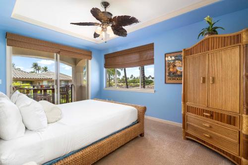 a bedroom with a large bed and a window at Mauna Lani Fairways 1101 in Waikoloa