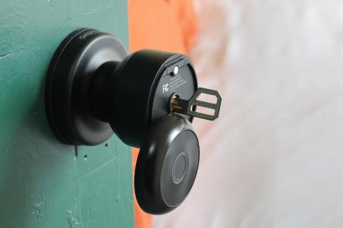 a black door lock attached to a wall at Home from Home 4 Bed - Ideal for Workers & Great for Groups, FREE Parking, Spacious, Pet Friendly Netflix in Kimberworth
