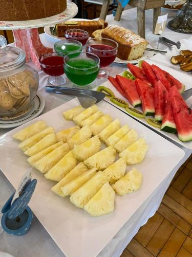 a table with a bunch of different types of fruit at Chalé Terrazza in Campos do Jordão