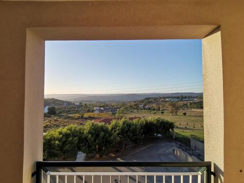 a view of a road from a balcony at Hotel Quinta dos Cedros in Celorico da Beira
