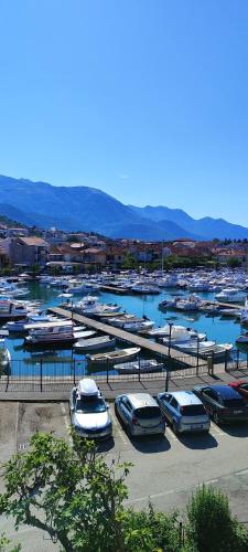 a bunch of boats parked in a harbor at Sea and Sunshine in Tivat