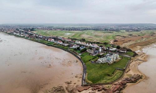 an aerial view of an island in the water at Charming Terraced House in Central Hoylake in Hoylake