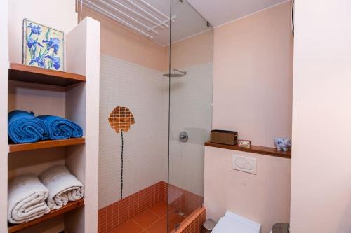 a bathroom with a shower with a glass door at Stunning apartment. Garage. Security. Mokotów area in Warsaw