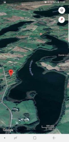 a map of a body of water with a red spot at Domek Letniskowy Krejwince in Krejwińce
