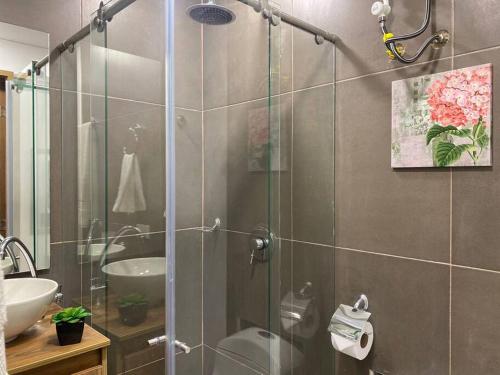 a bathroom with a shower with a glass door at Acogedor Loft en Bogotá in Bogotá