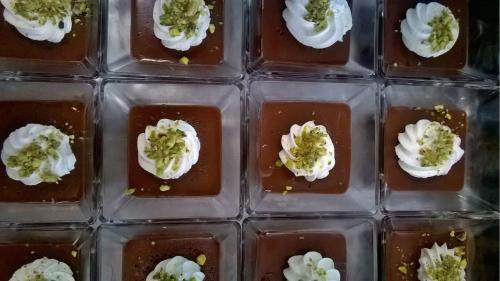 a container of chocolate with broccoli and white whipped cream at Hotel Du Parc in Atri