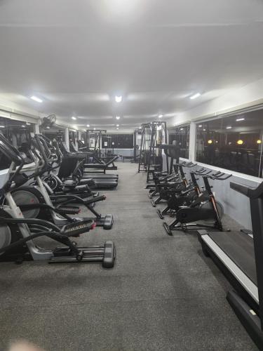a gym filled with rows of exercise bikes at La Grande Residence 10th Floor Deluxe Unit in Angeles