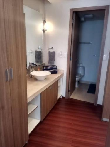 a bathroom with a sink and a toilet at High-Rise Reforma Apartment , 2BDR, 2BATH, in Mexico City