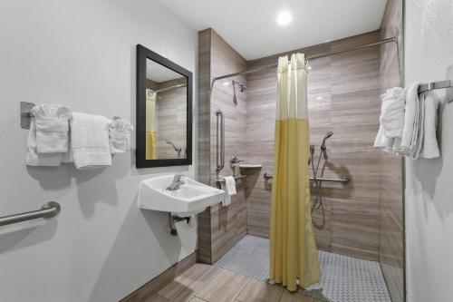 a bathroom with a sink and a shower at Motel 6-Escondido, CA in Escondido