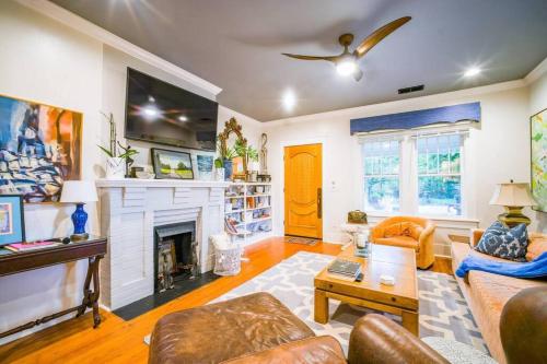 a living room with a couch and a fireplace at The Cullman Haus-Steps frm Cullman High-CHORE FREE in Cullman