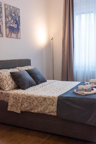 a bedroom with a bed with a tray on it at Balkan dream **** in Belgrade