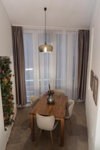 a dining room with a table and a christmas tree at Balkan dream **** in Belgrade