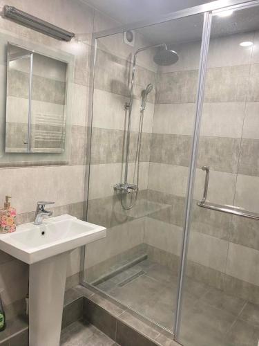 a bathroom with a sink and a shower at Apartment in Ejmiactin in Vagharshapat