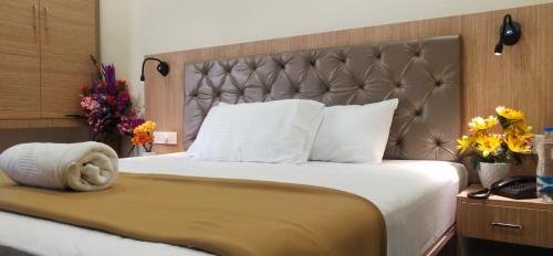 Кровать или кровати в номере Hotel Amutham